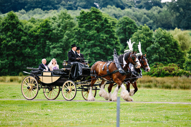Bride and her father arrive at Capesthorne Hall in a horse and carriage