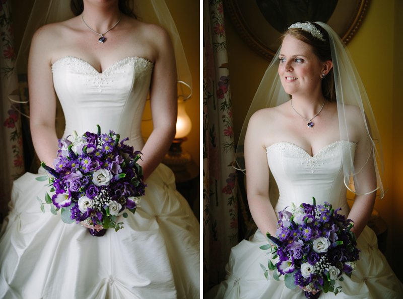 Bride looks out of window holding her bouquet