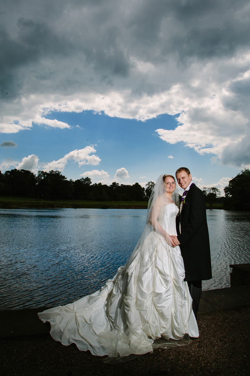 Holding hands in front of the lake