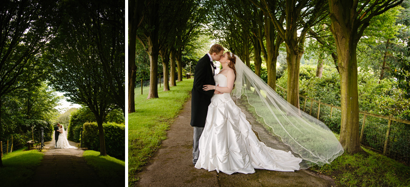 Bride and Groom walk down a tree lined path