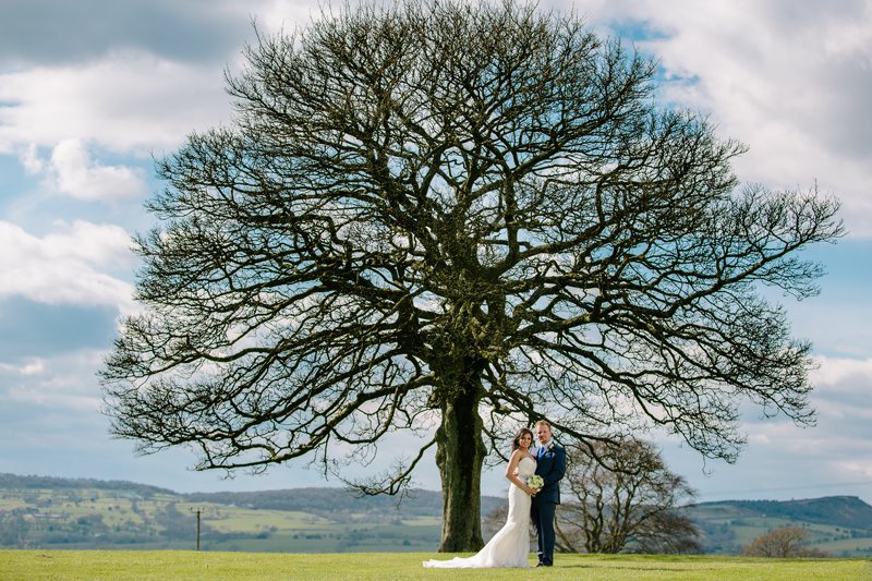 Bride and groom with the Tree at Heaton House Farm