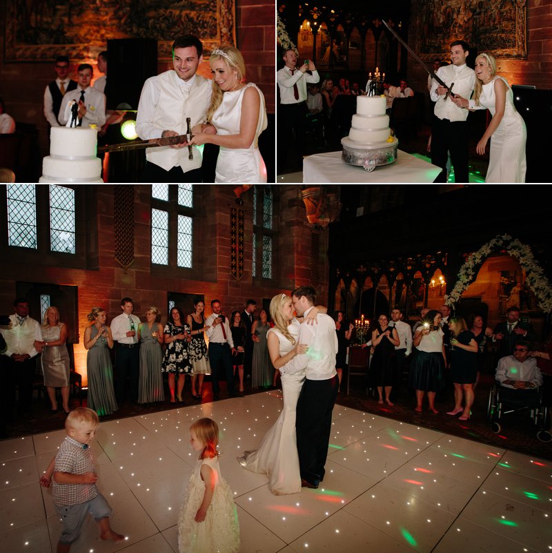 Bride and Groom cut wedding cake with sword