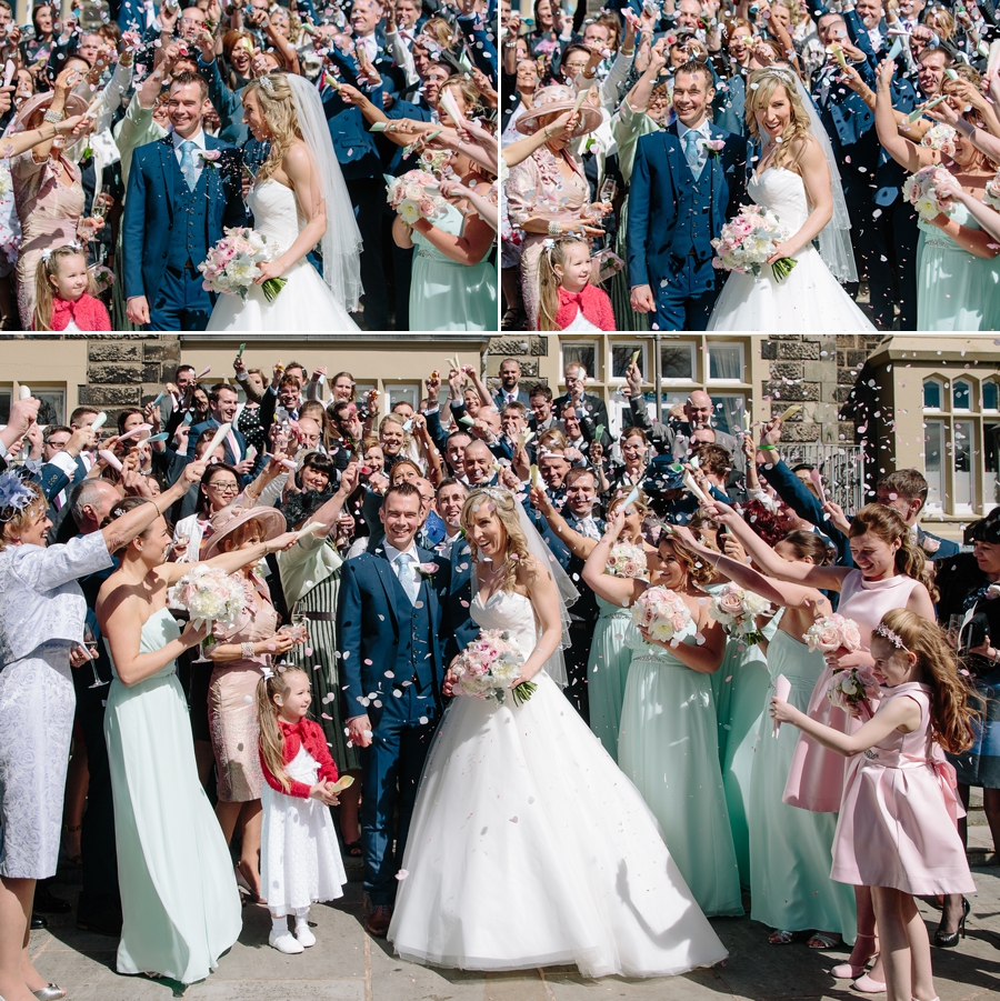 Bride and groom getting showered by confetti