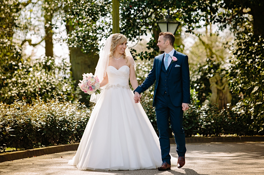 Bride and groom laughing in the sun