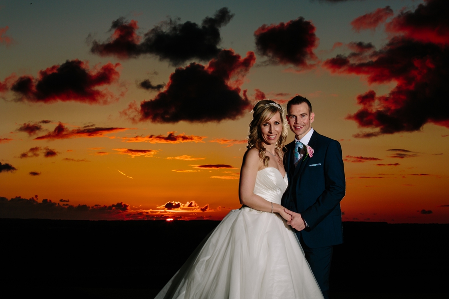 West tower sunset with the bride and groom