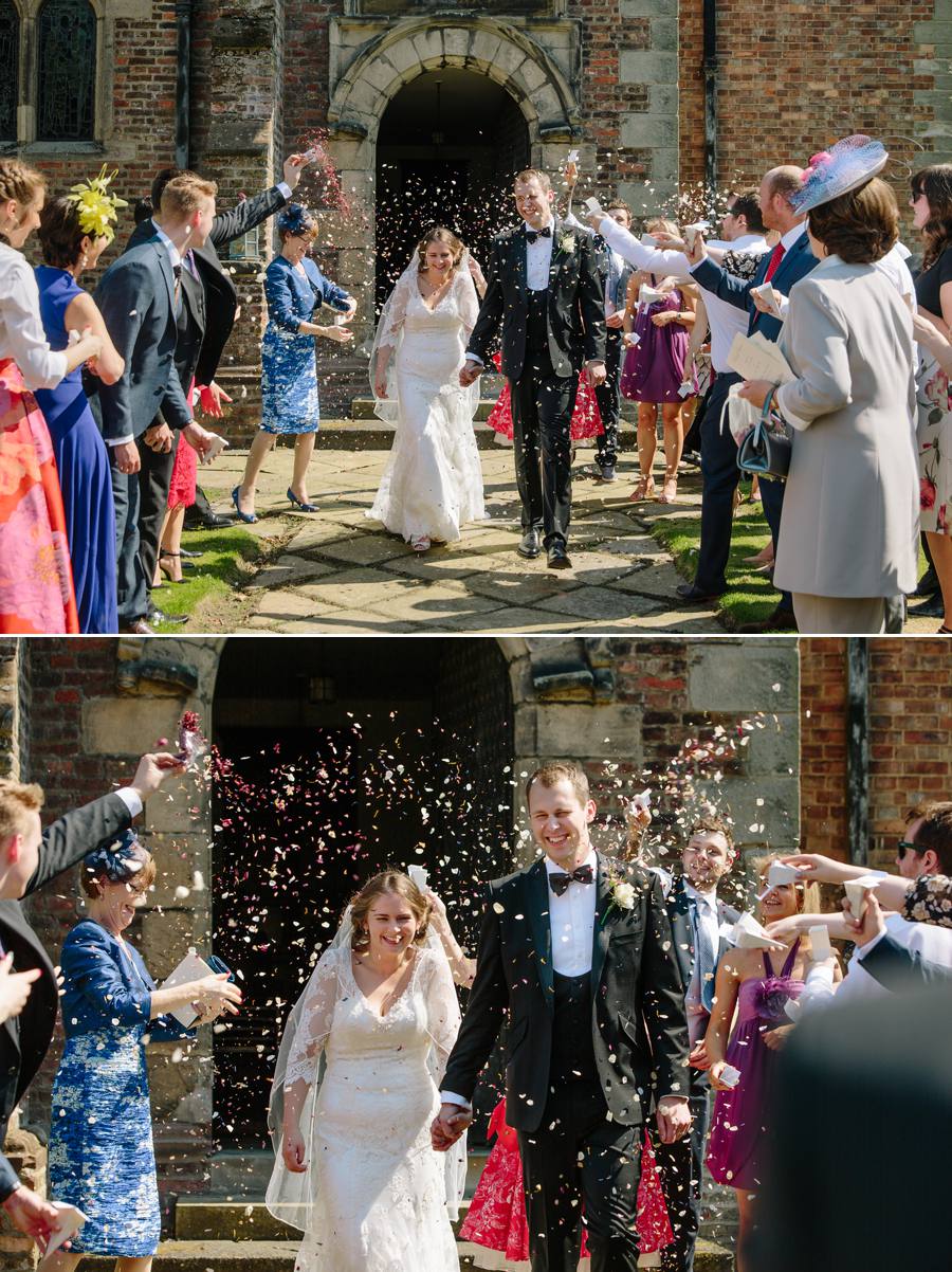 Bride and groom getting showered in Confetti as they exit the chapel