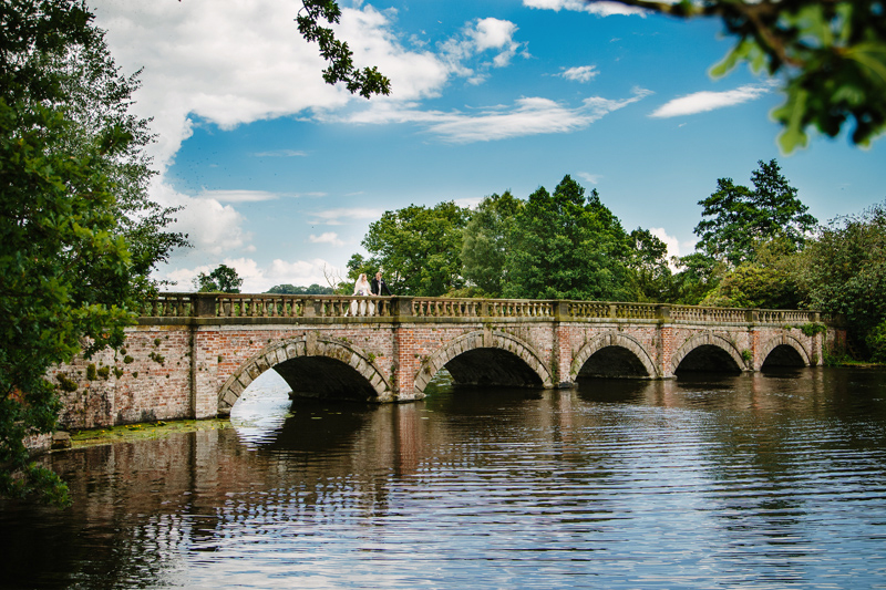 Bride and Groom on Bridge at Capesthorne Hall