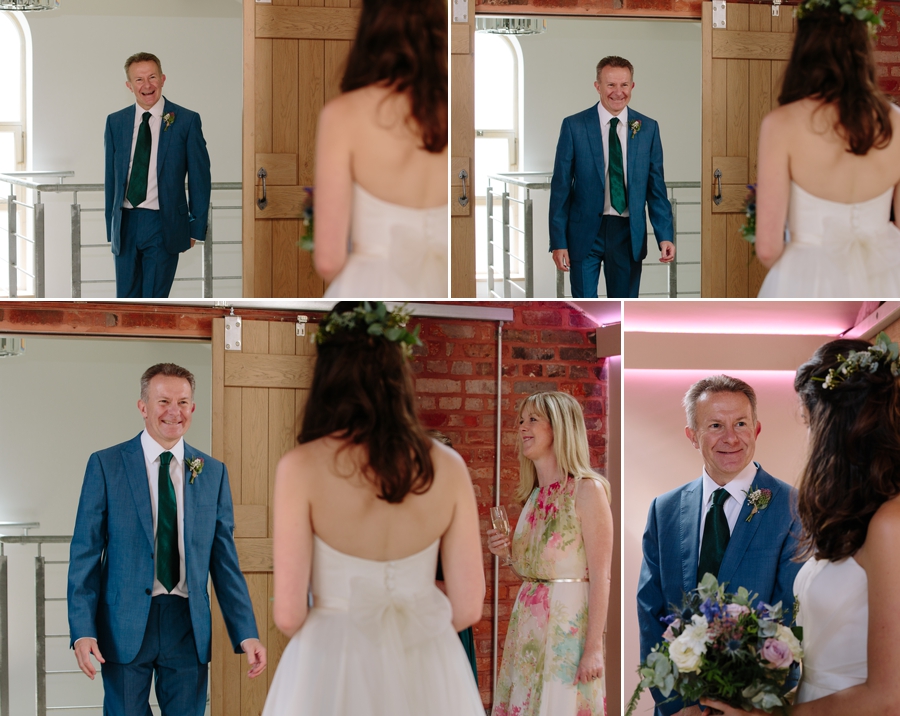 The first look of a father seeing his daughter in her wedding dress while mum looks on