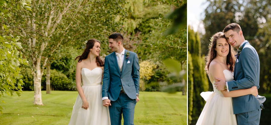 Bride and Groom holding hands walking through the beautiful gardens