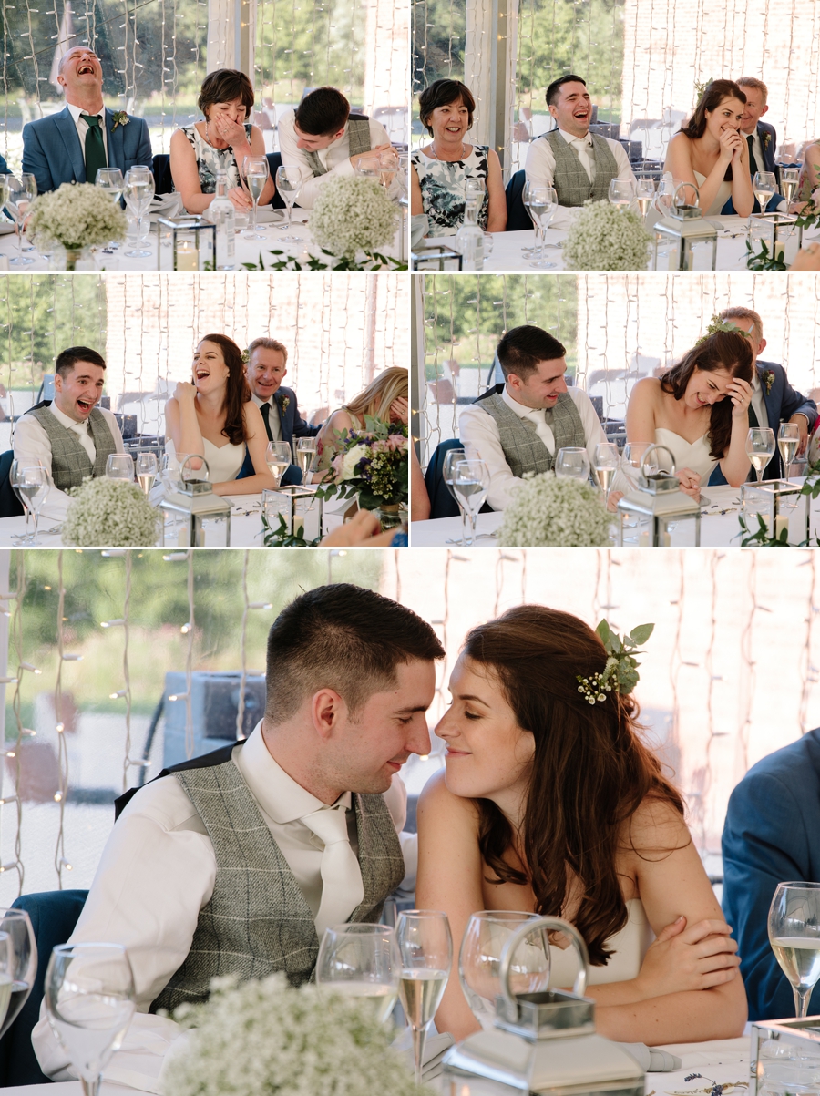 Bride and Groom laughing during the wedding speeches