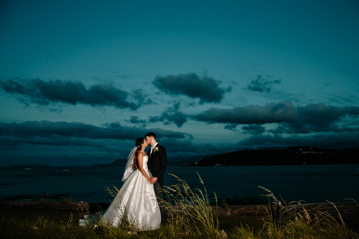 Lovely early evening twilight with the bride and groom overlooking the sea