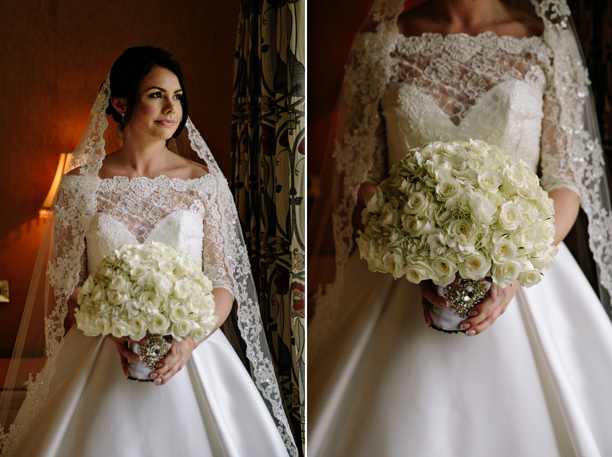 Beautiful bride in her wedding gown and white rose bouquet with silver broch