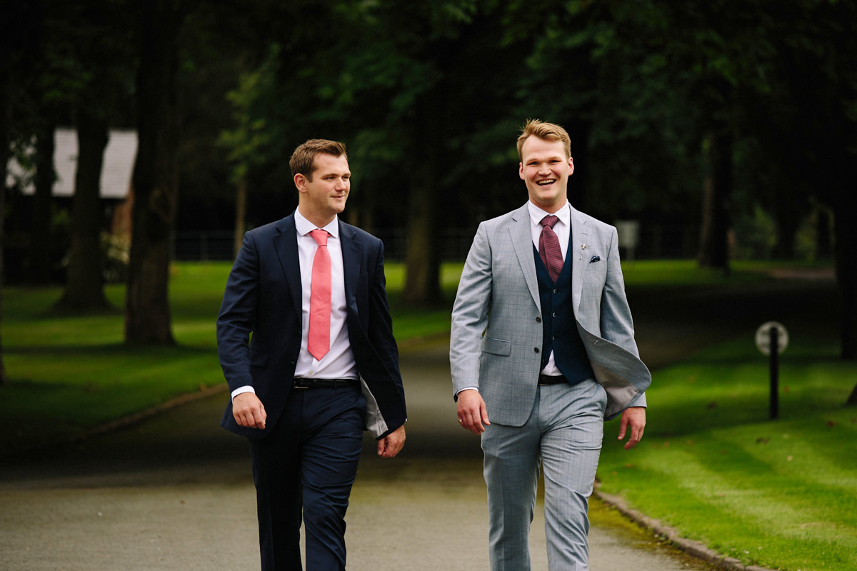 Groom and best man on the way to their wedding