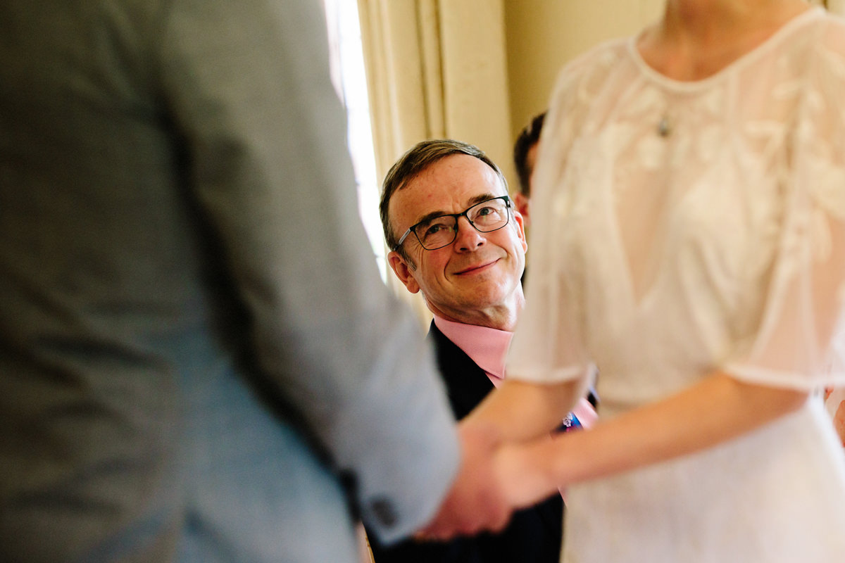 Father of the bride watching his daughter during the ceremony at Colshaw Hall