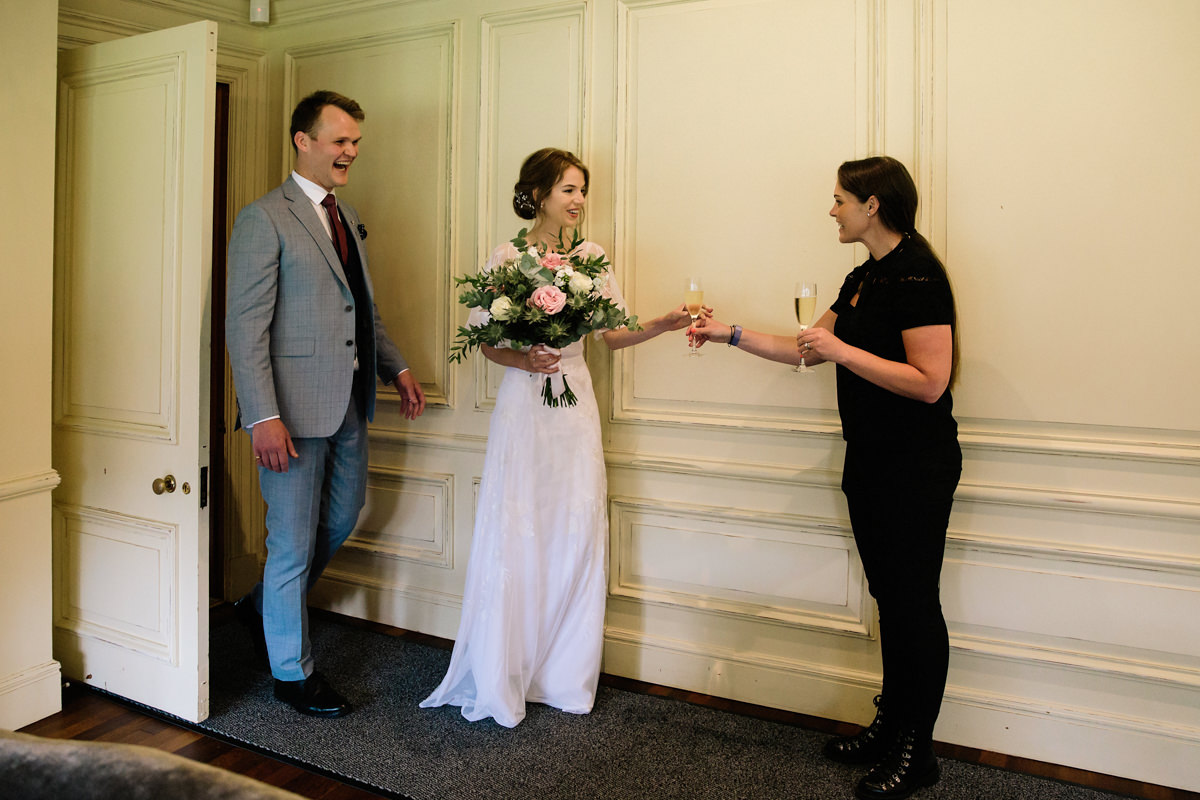 Shelly from Colshaw Hall welcomes the newly married bride and groom with drinks