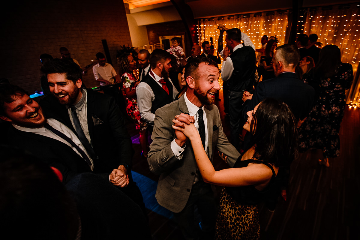 Partying and dancing at a wedding in Cheshire