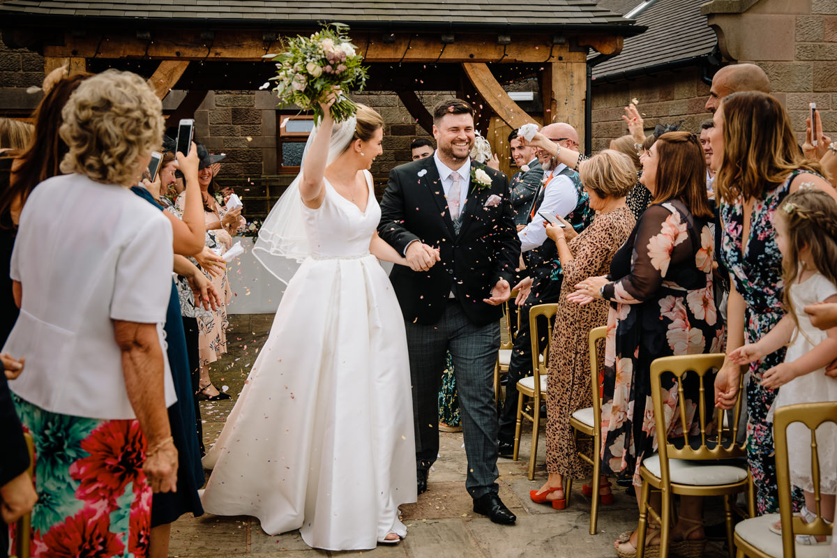 Bride and Groom getting married outside at the Oak Pagoda at Heaton House Farm