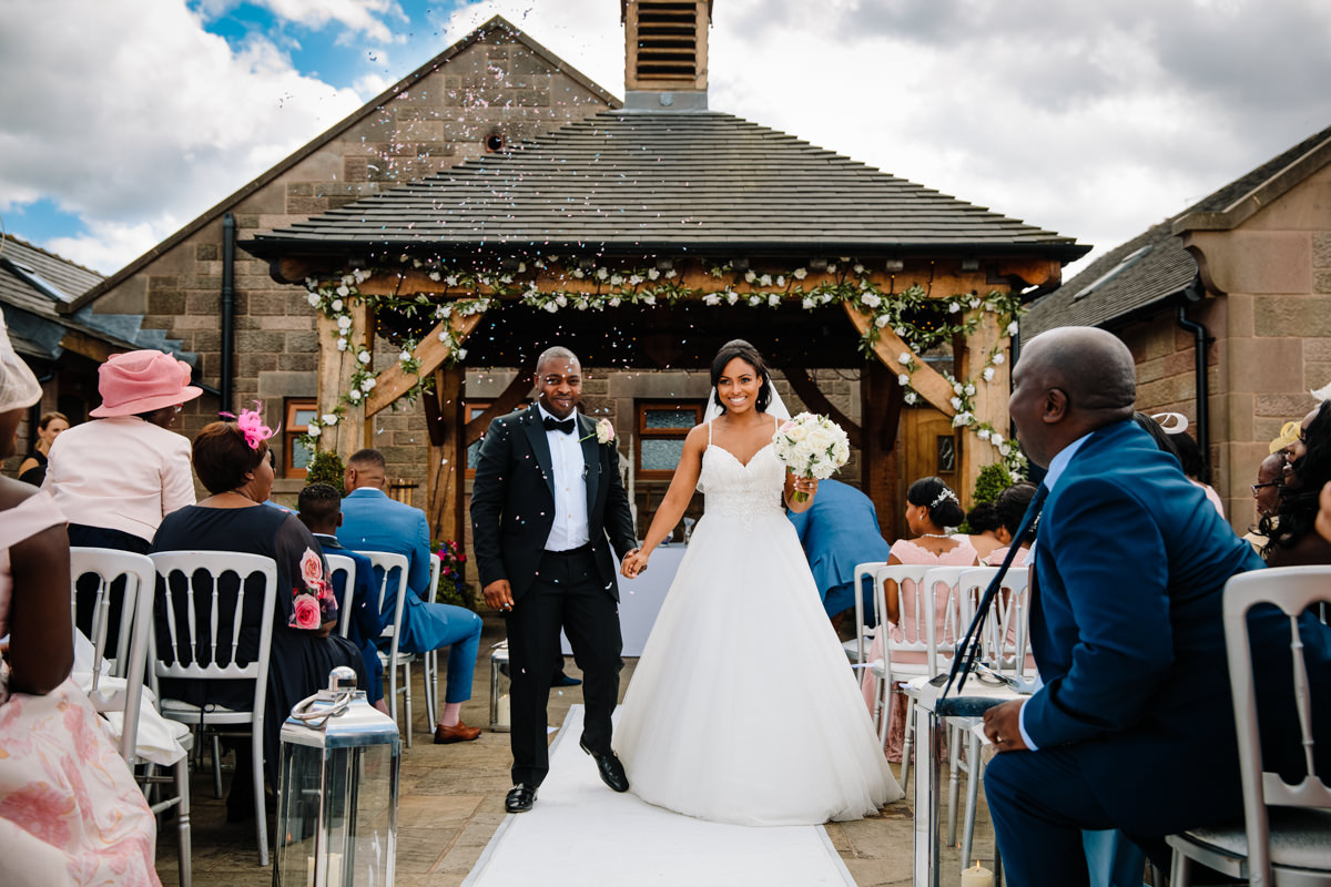 Bride and Groom getting married outside