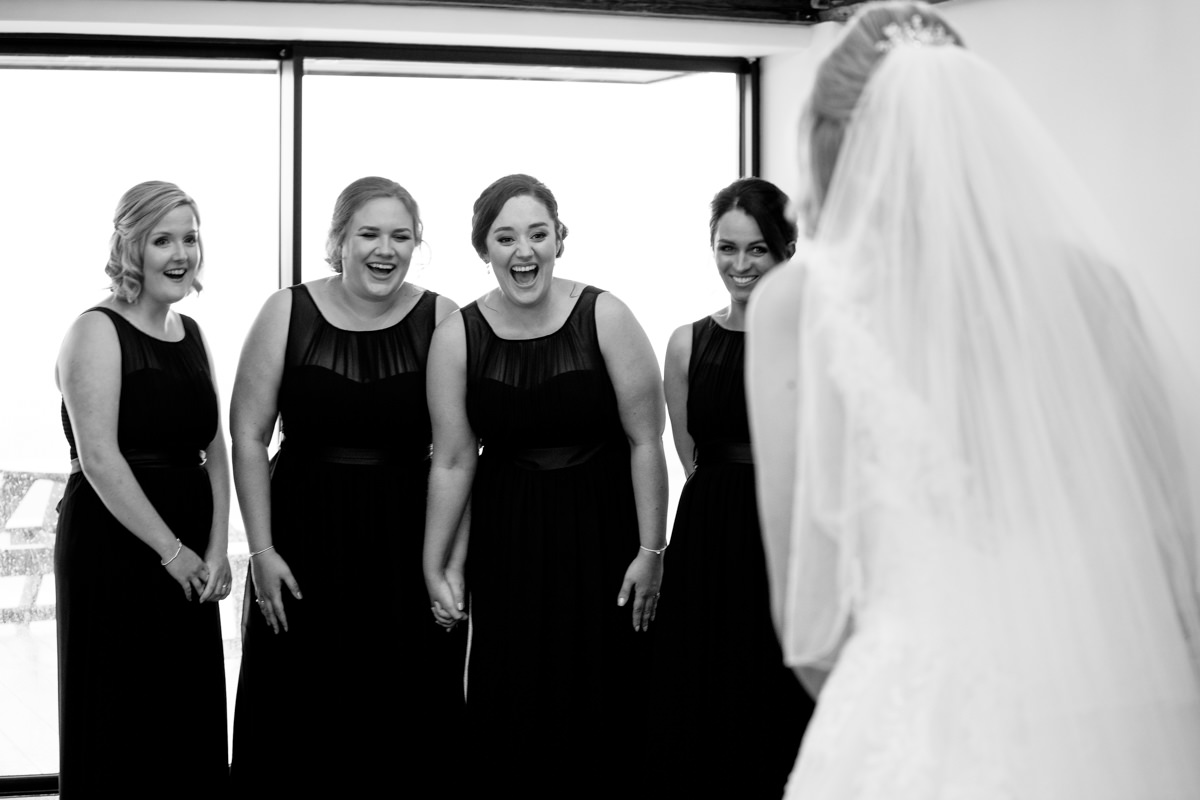 Bridesmaids seeing the bride for the first time