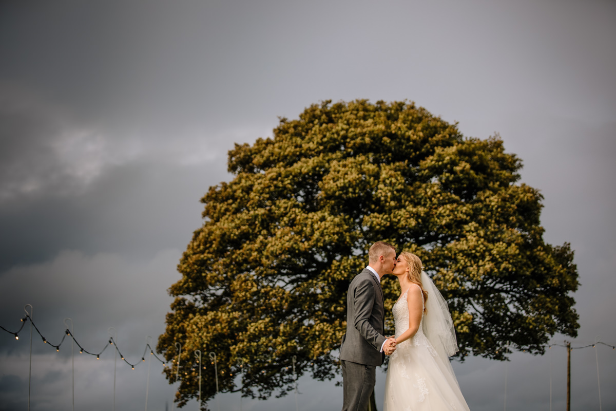 Bride and Groom and the Sycamore tree at Heaton House Farm