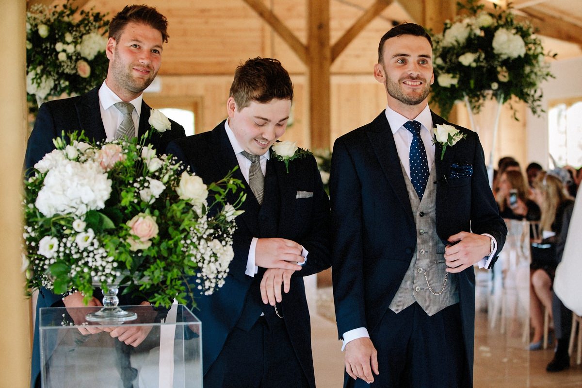 Groom and best man checking the time