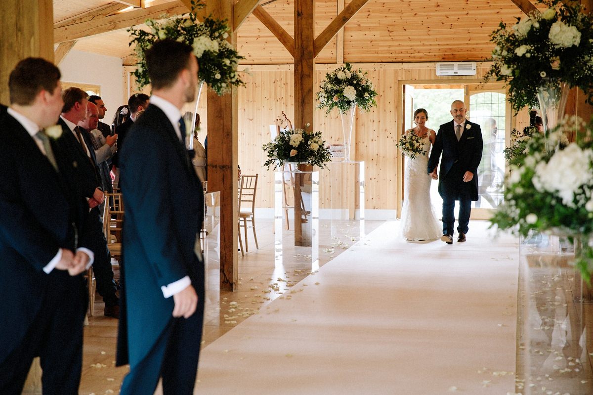 Bride walking down the aisle with her father