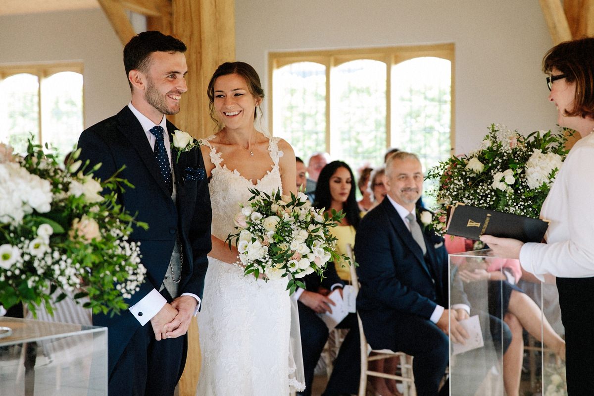 Happy moment at the altar with the bride and groom