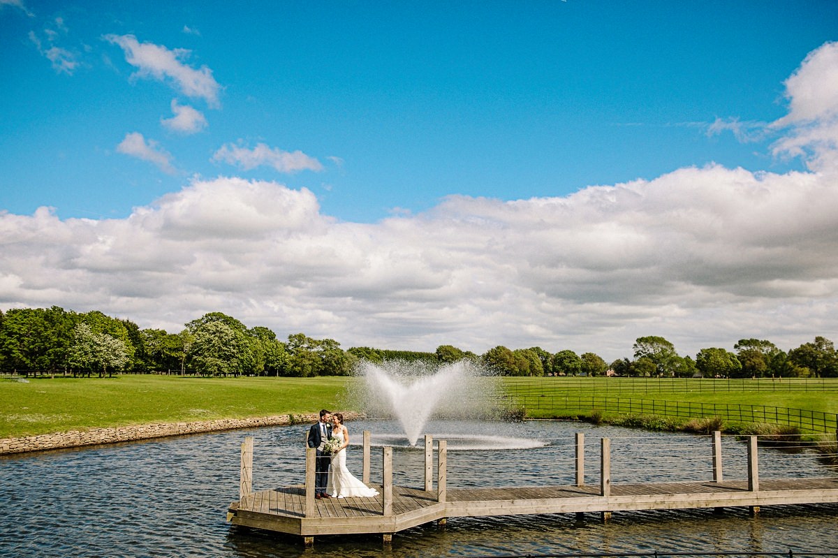 The Lake and fountain with the bride and groom