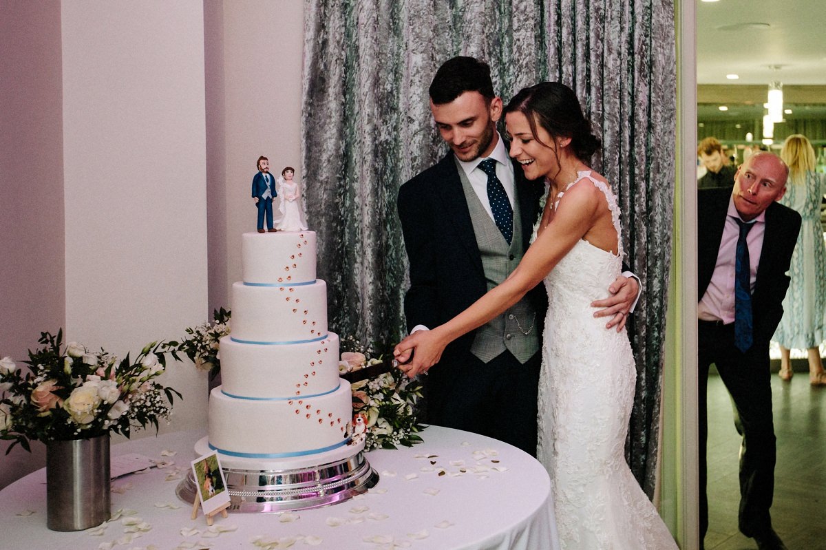 Guest watching the cake cut, very funny