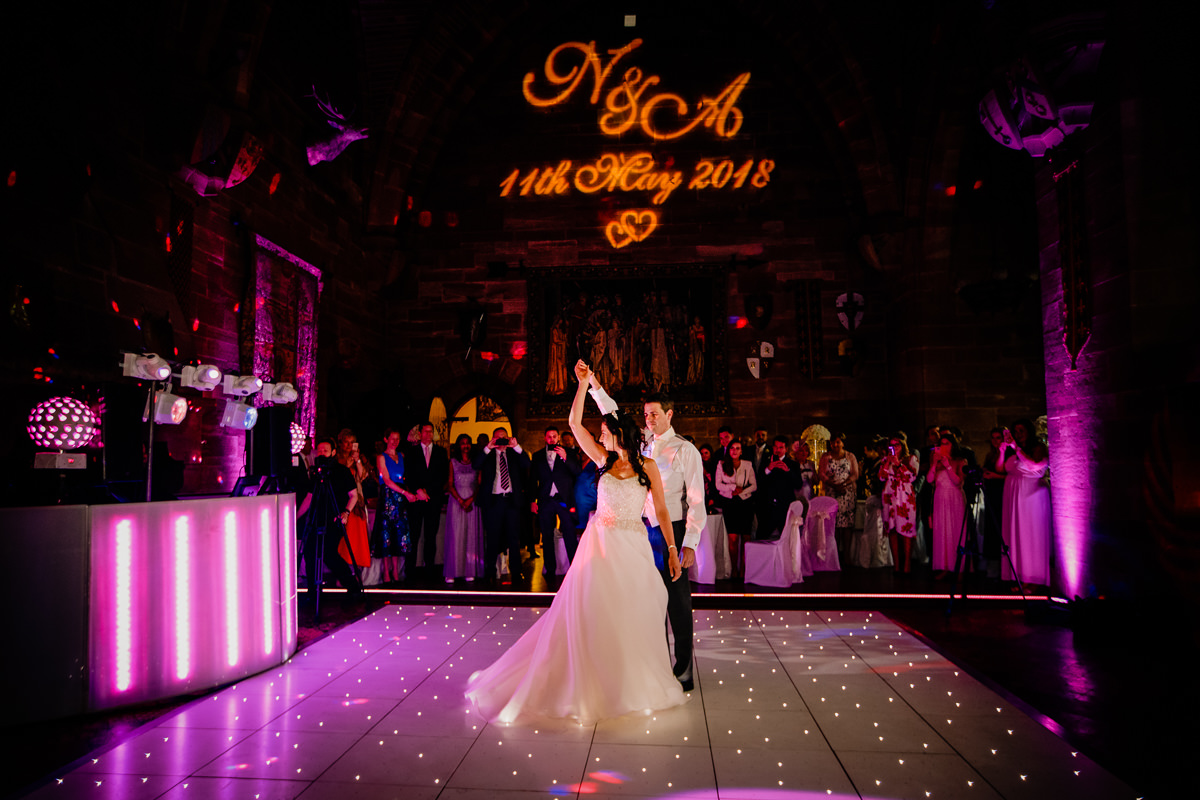 The first dance of the bride and groom in the great Hall at Peckforton Castle