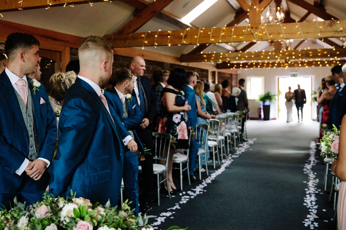 Bride and her dad about to walk down the aisle