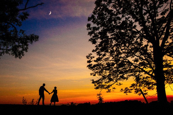 Sunset with silhouette of the Bride and Groom