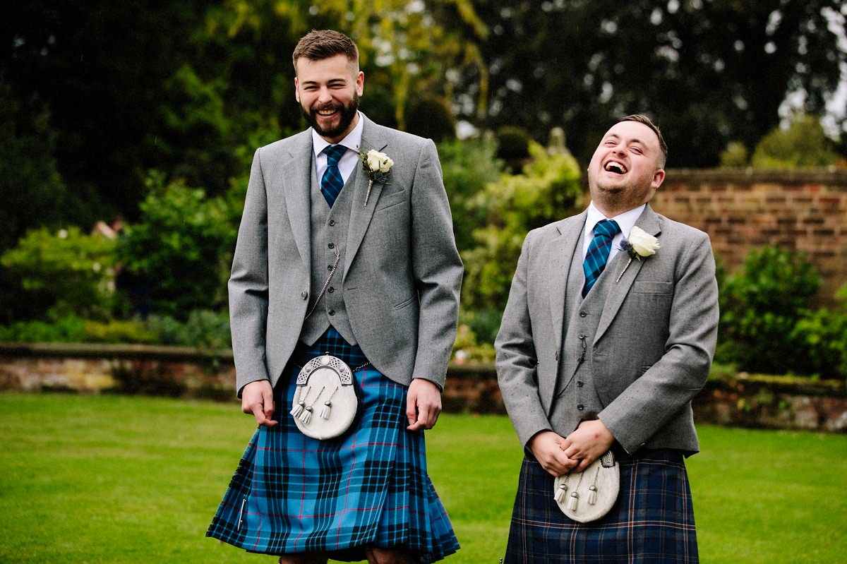 Groom and Best man in kilts having fun