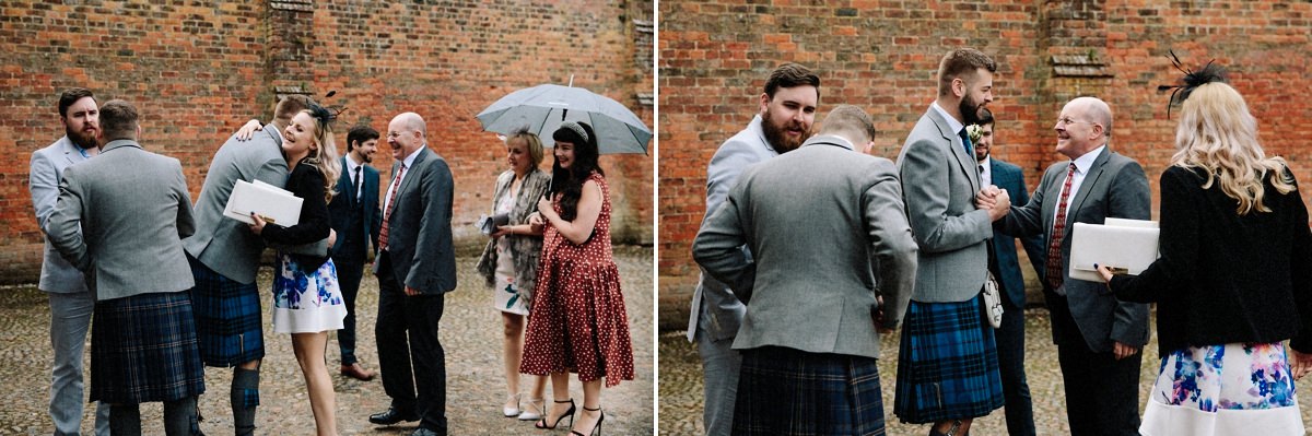 Wedding guests arriving and greeting the groom