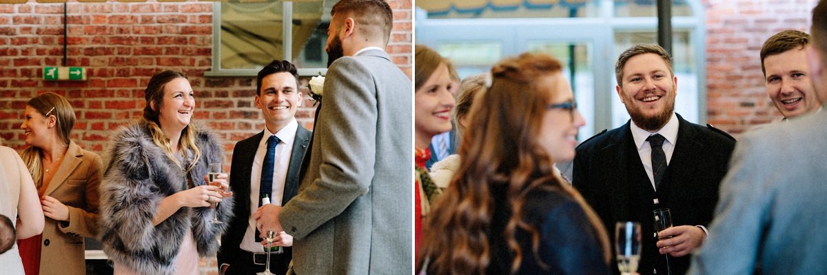 Wedding guests enjoying drinks and laughing