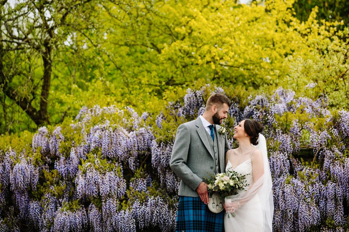 Bride and groom in the gardens at Arley Hall