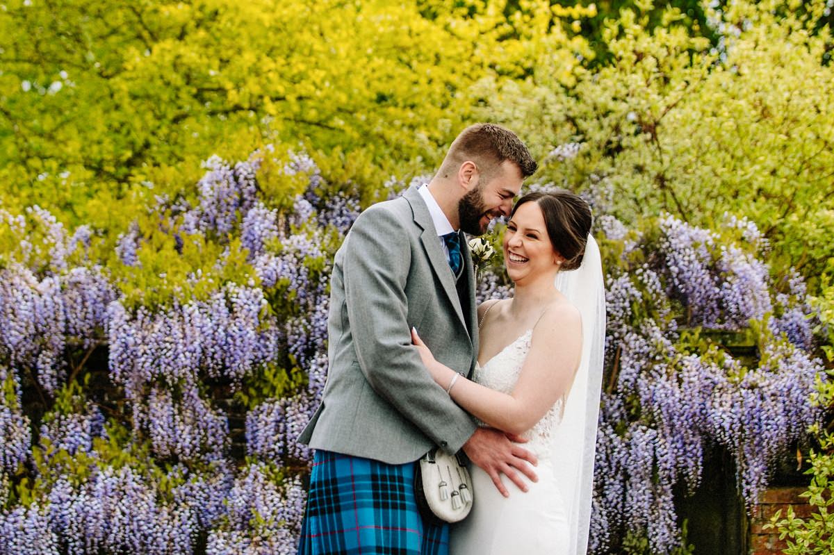 Natural moment captured between the bride and groom at Arley Hall gardens