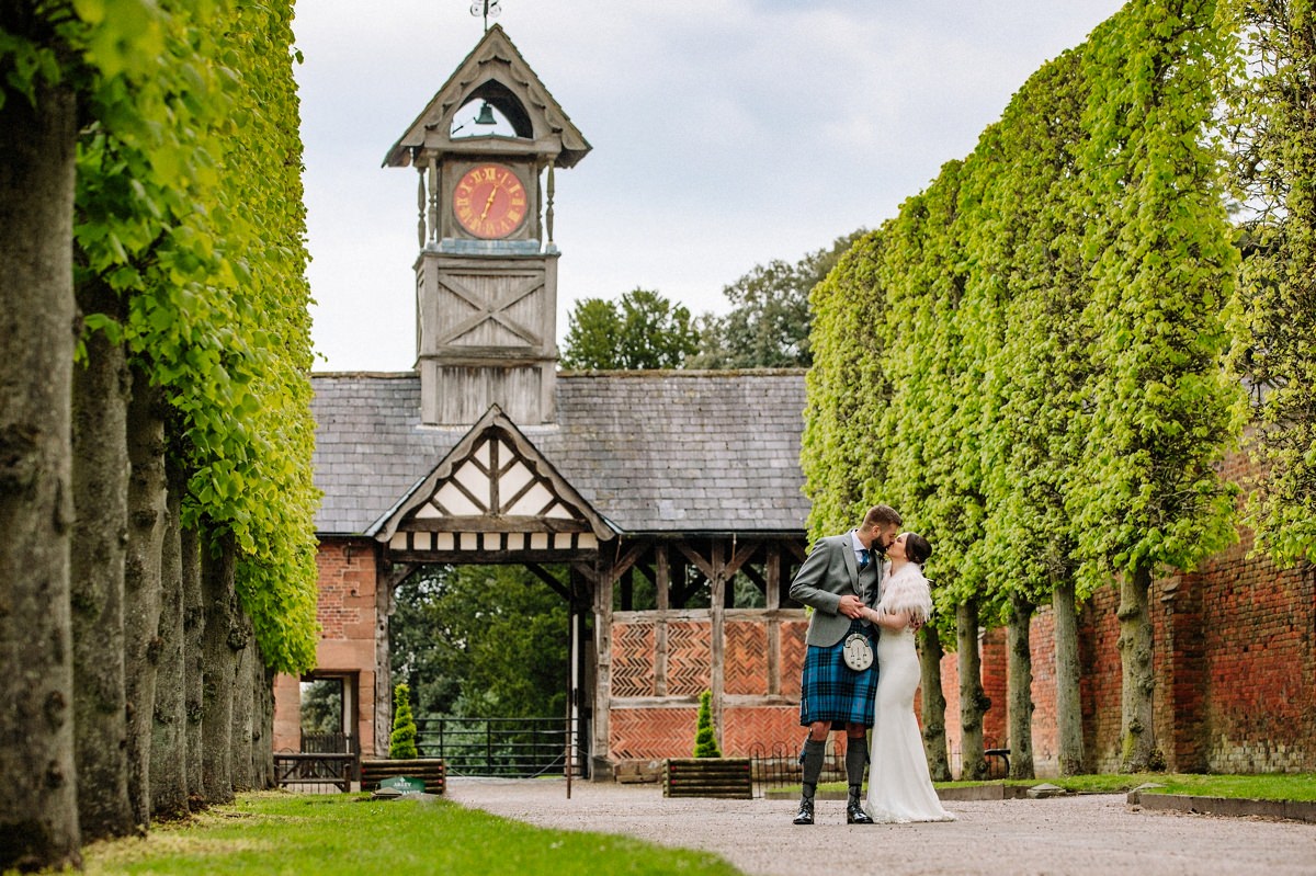 The Clock Tower at Arley Hall with the bride and groom