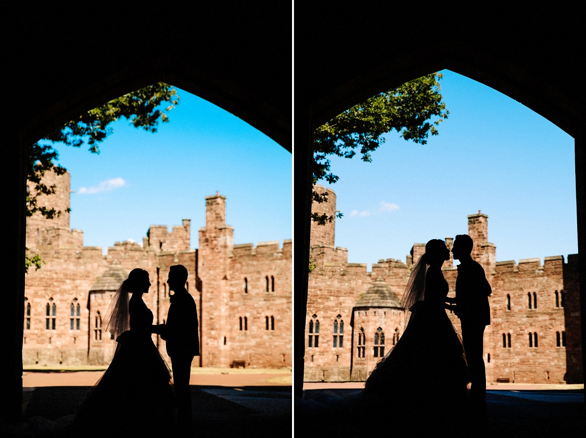 silhouette with the bride and groom under the drawbridge at Peckforton Castle