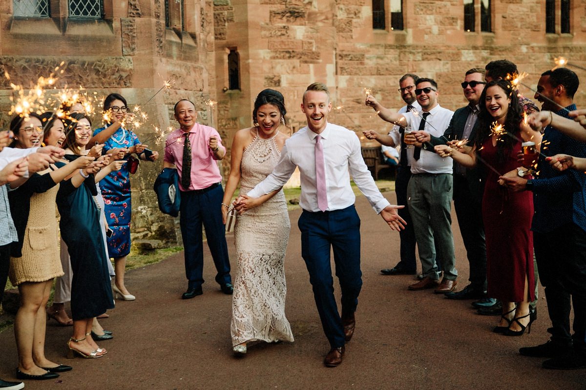 Sparkler exit at Peckforton Castle with the bride and groom