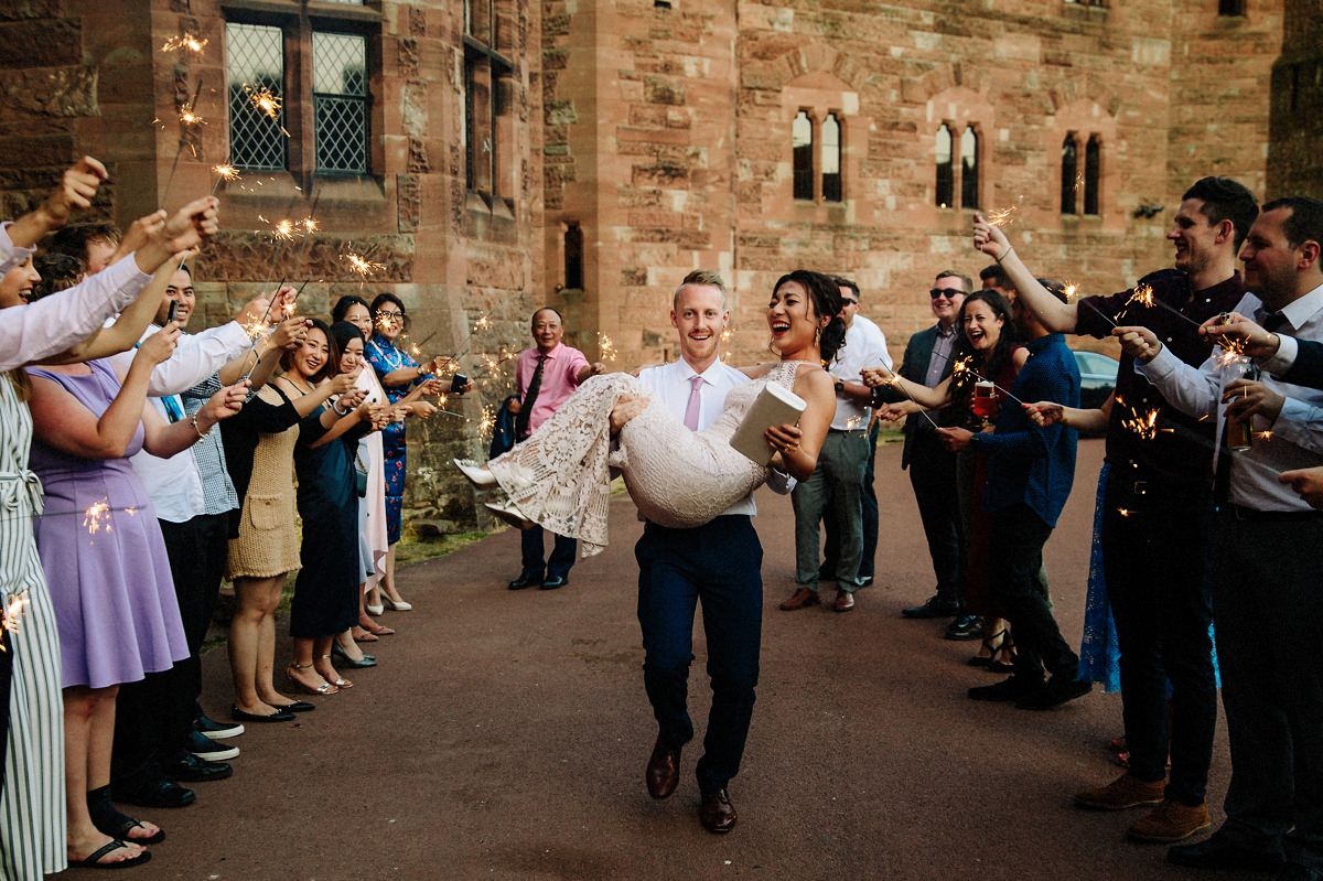 Sparkler exit at Peckforton Castle with the bride and groom